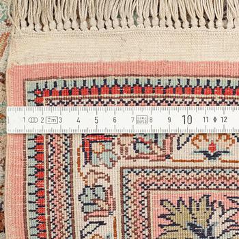 A silk Ghom rug, c. 185 x 122 cm.