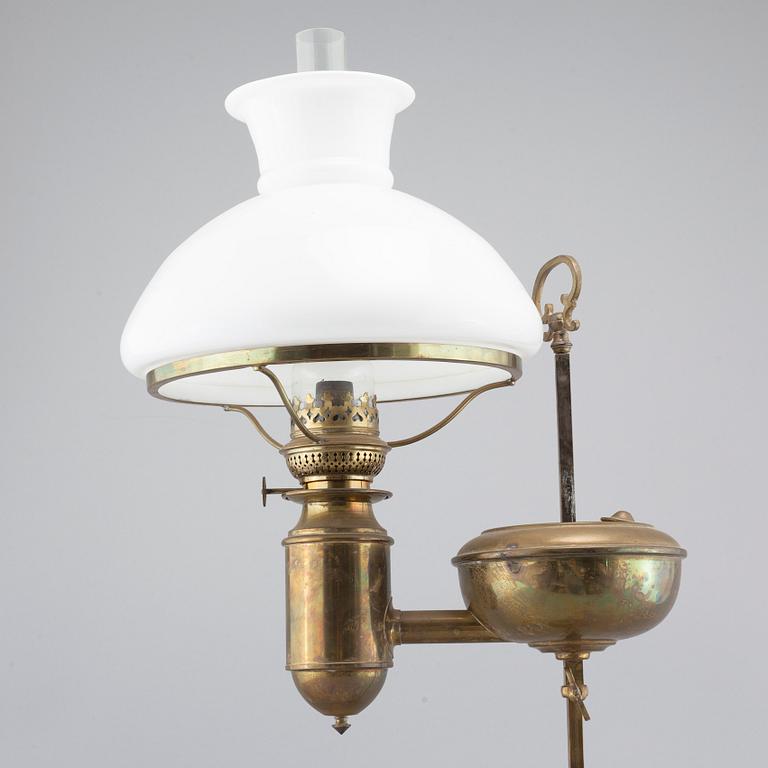 A table paraffin lamp, marked "Kosmos Brenner", around year 1900.