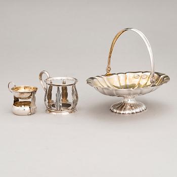 A silver basket and a tea glass holder with a revolving tea strainer, Kultakeskus, Hämeenlinna, Finland 1955-58.