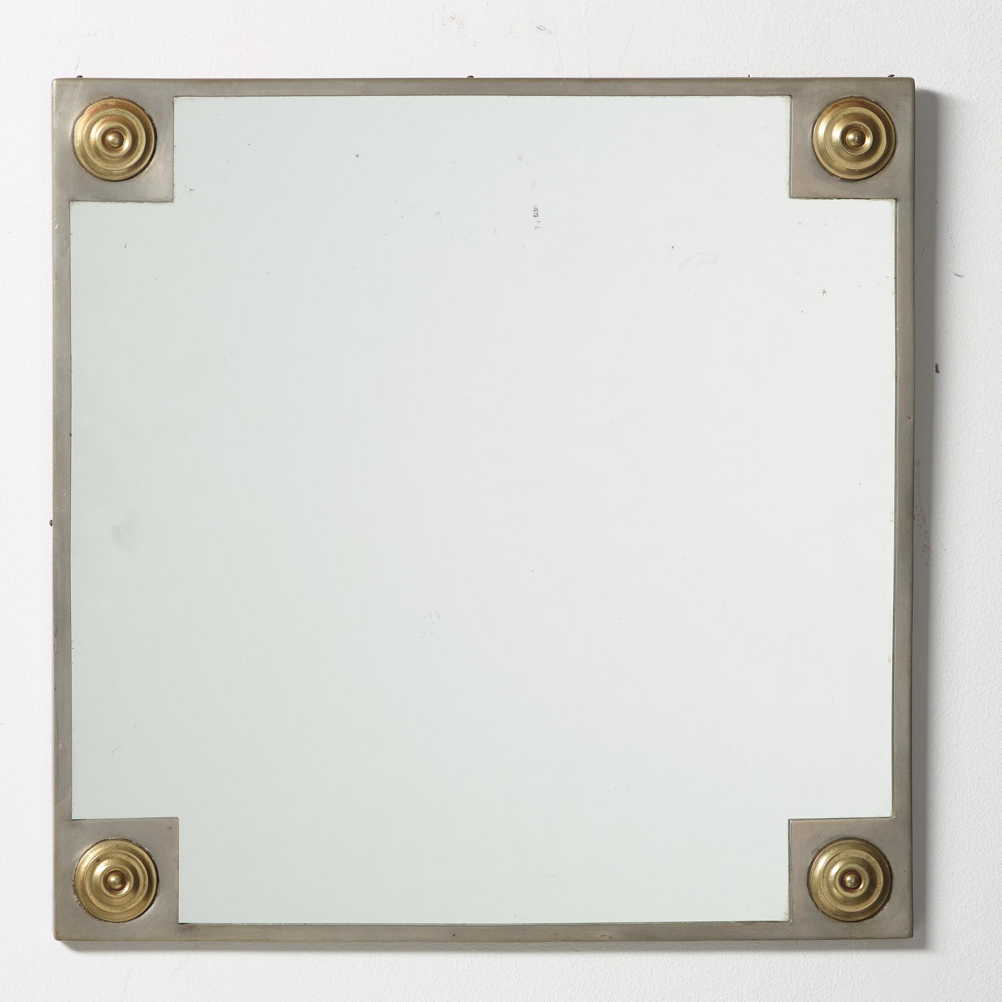 Firma Svenskt Tenn, a pewter and brass mirror, Stockholm 1928.