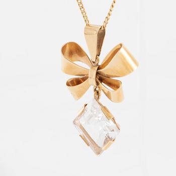 Necklace, 18K gold with synthetic white stone, in the shape of a bow.