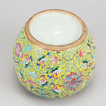 A yellow ground famille rose lotus jar, China, early 20th Century.