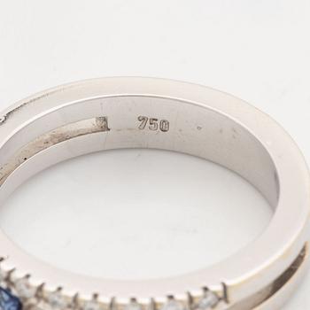 18K white, brilliant cut diamond and sapphire.