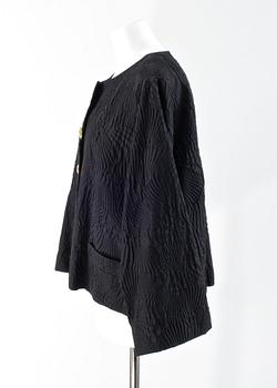 A 1991s jacket by Yves Saint Laurent.
