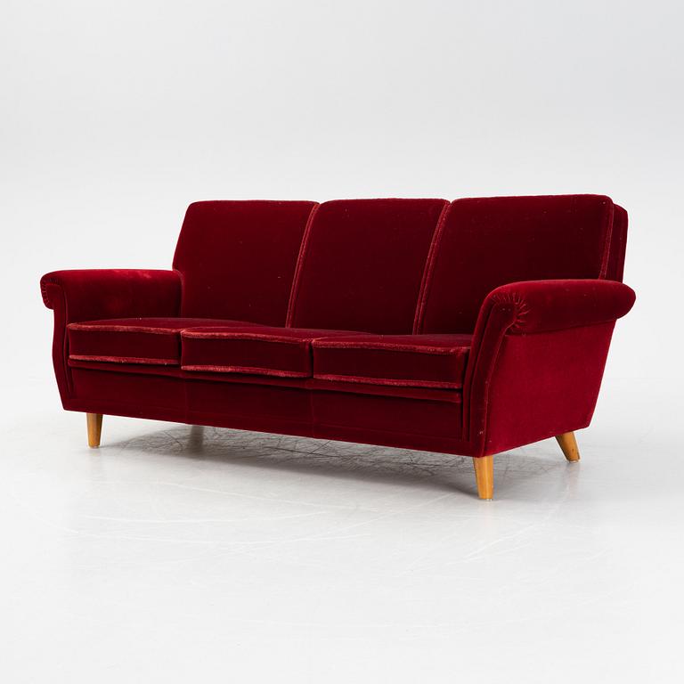 A velvet upholstered sofa, mid 20th Century.
