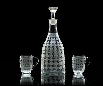 370. An early 19th century glas decanter with stopper and a pair of cups.