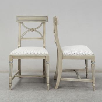 A dining table and six chairs, Gustavian style, second half of the 20th century. One leaf included.