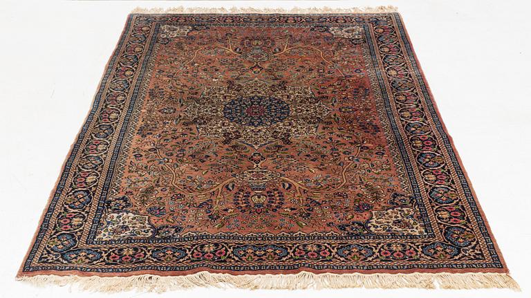 An oriental rug, circa 245 x 136 cm.