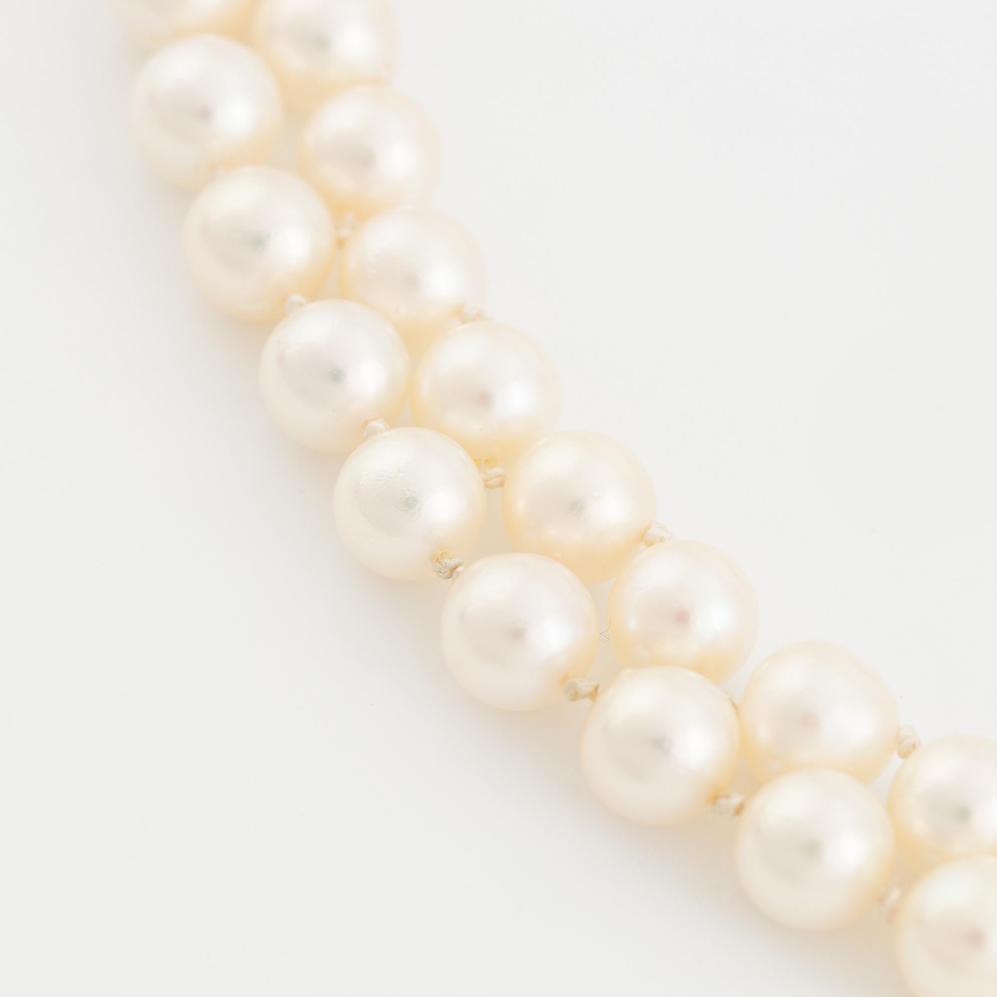 Two strand cultured pearl necklace, clasp with diamonds.
