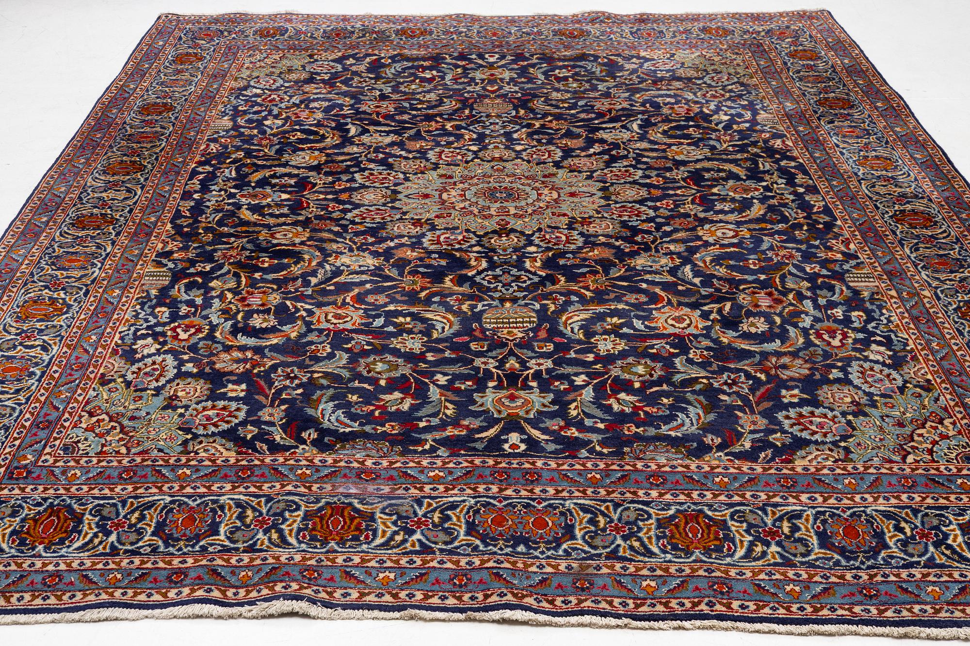 An oriental carpet, c. 390 x 295 cm.