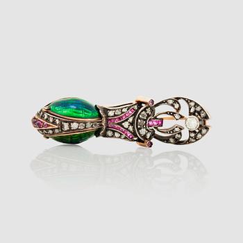 1451. A ruby, rose-cut diamond and enamelled brooch in the shape of a bettle.