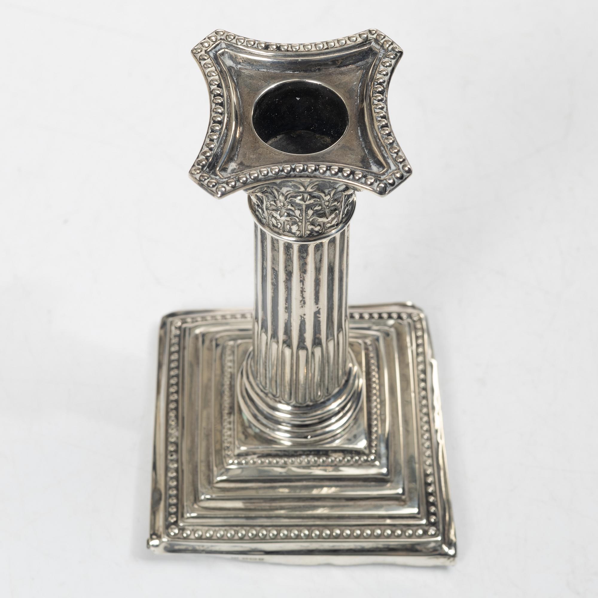 A pair of English silver column candlesticks, mark of Walter Latham & Son, Sheffield, 1910.