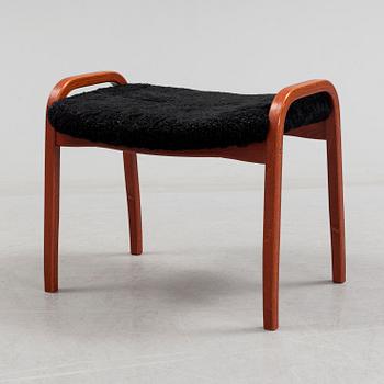 A 'Lamino' foot stool by Yngve Ekström, Swedese.