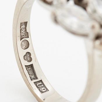 An 18K white gold ring set with round brilliant- and navette-cut diamonds.