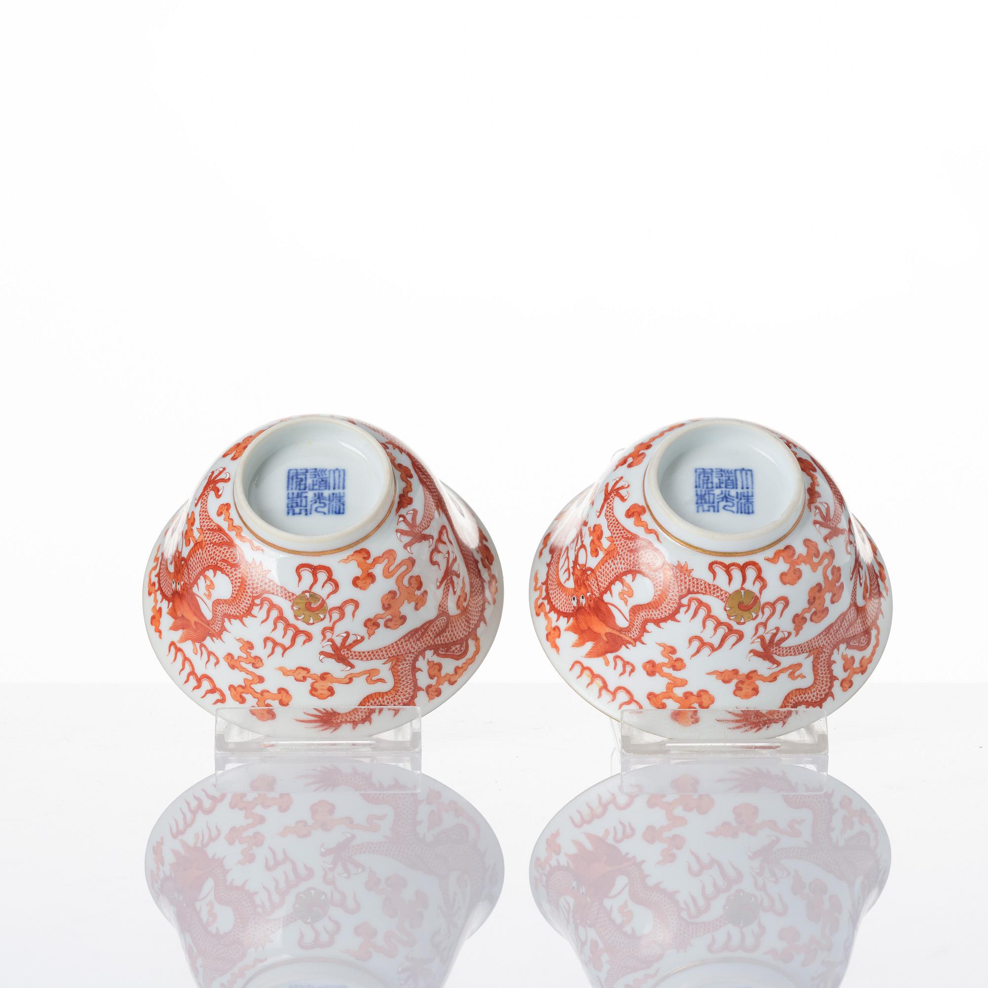 A pair of five clawed dragon bowls on stands and a cover, Qing dynasty, Daoguang mark and period (1821-50).