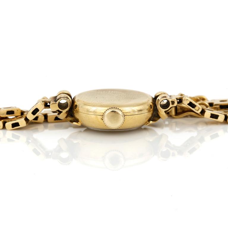 ARMBANDSUR, dam, 18K guld, 'Cyma, CymaFlex' Le Locle, Schweiz 1900-talets mitt. Total vikt ca 18,97 g.