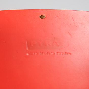 Per Sundstedt, a wood rocking stool from Pyra, Sweden.