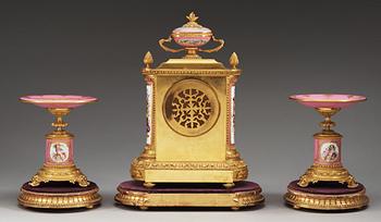 A three piece gilt-bronze clock garniture, by Charles Fredrick Wassel, 43 Frenchurch Street, London ca 1869.