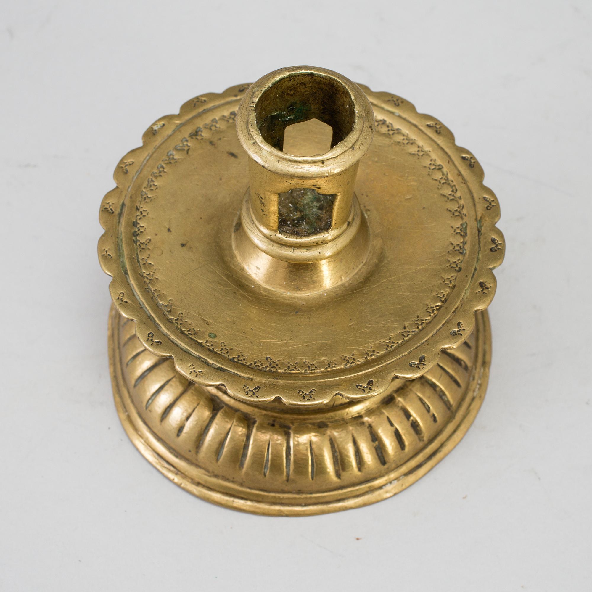 A 16th century bronze candlestick.