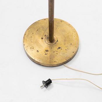 A brass floor light, seond part of the 20th Century.