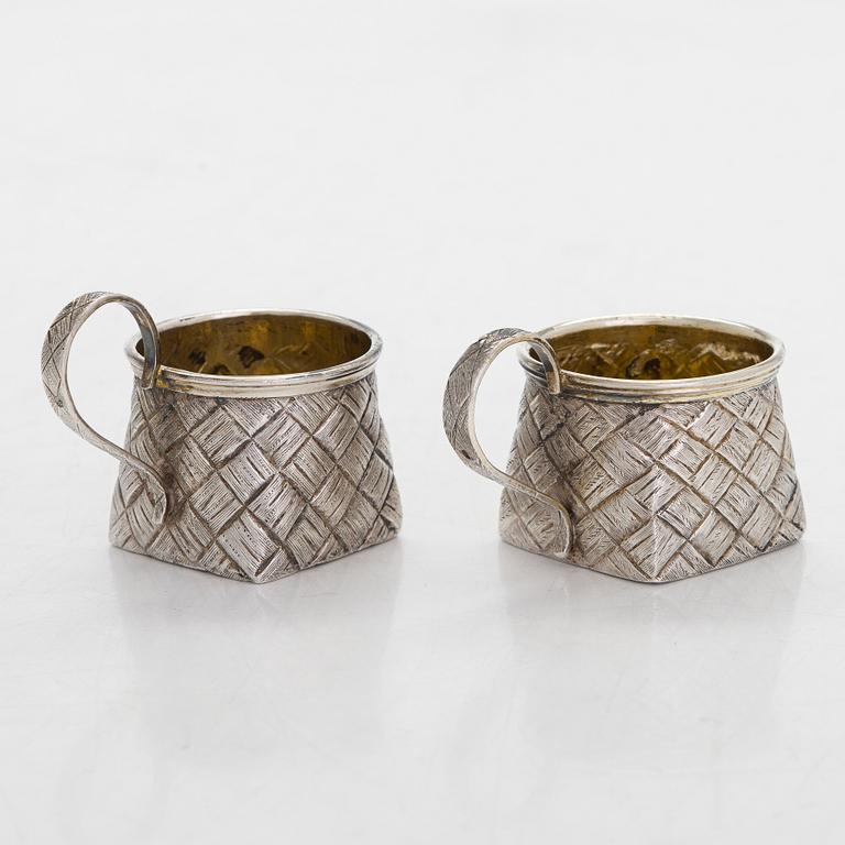 A silver and glass bottle with eight silver charka, maker marks of Pyotr Yermolajevich Davidov, Saint Petersburg, 1884.