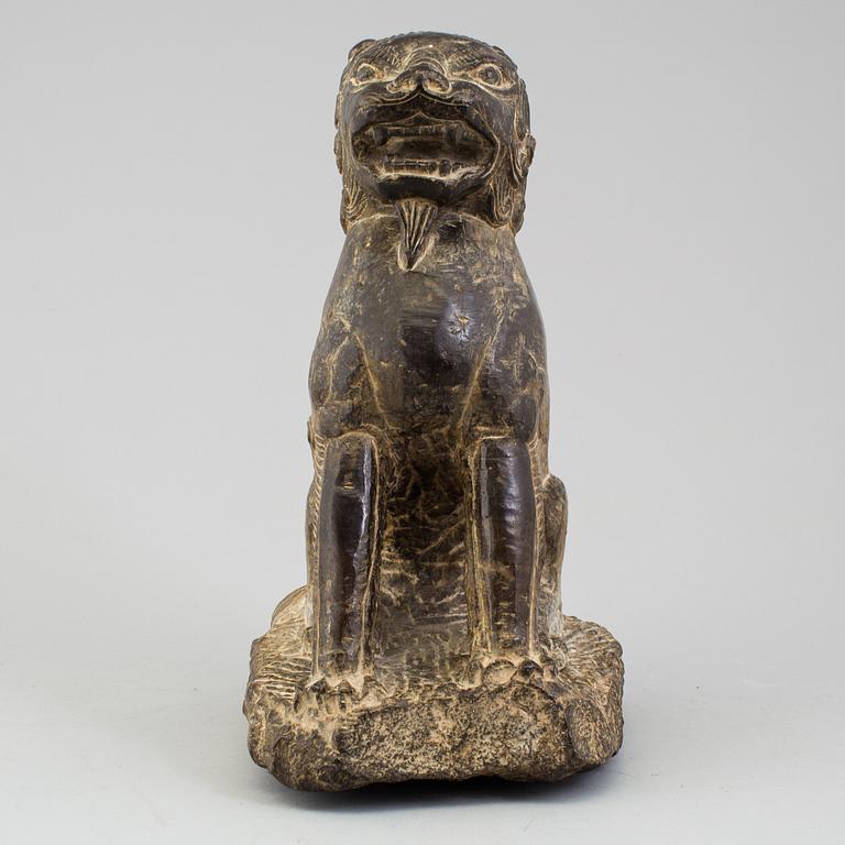 A stone sculpture of a mythical beast, China, 20th Century.