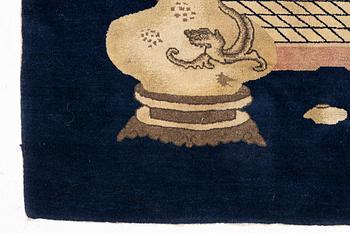 A semi-antique Baotou rug, approx. 185 x 122 cm.