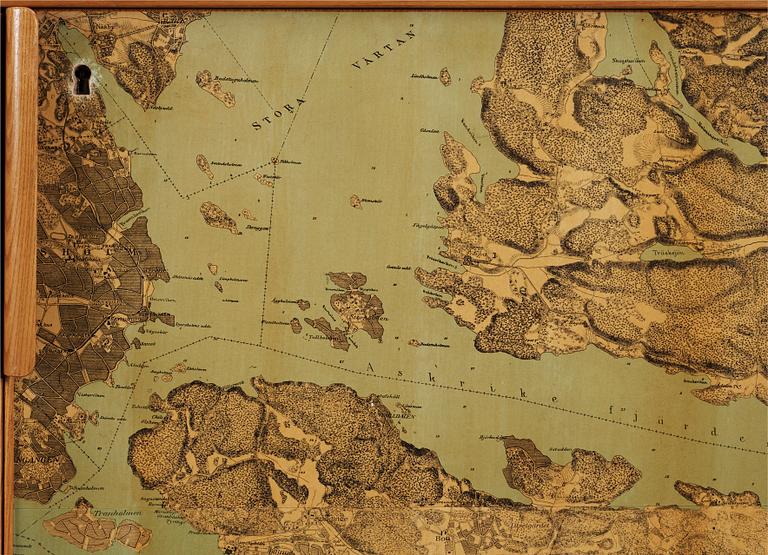 A G.A. Berg cabinet with printed map depicting the city of Stockholm, Sweden 1940's.