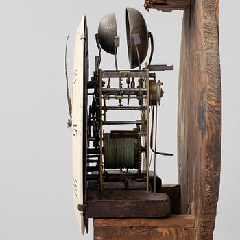 A long-case clock, 19th century.
