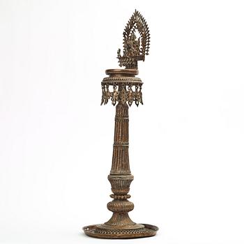 A copper alloy temple lamp, Nepal, circa 1900.