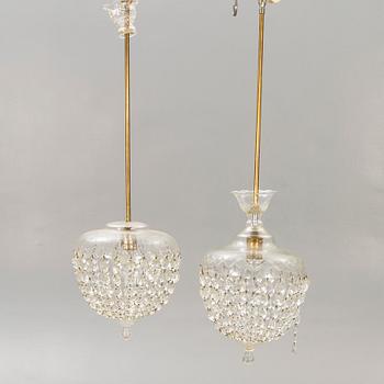 A pair of ceiling pendants around 1900.