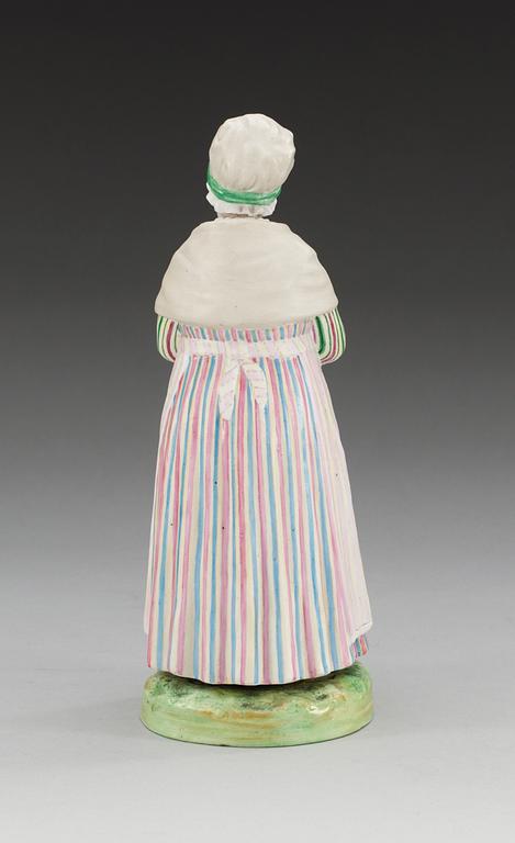 A Russian figure of a Lett woman, Gardner/Kuznetsov manufactory, ca 1900.