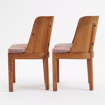 Axel Einar Hjorth, a pair of stained pine "Lovö" armchairs, Nordiska Kompaniet,  Sweden, 1930s.