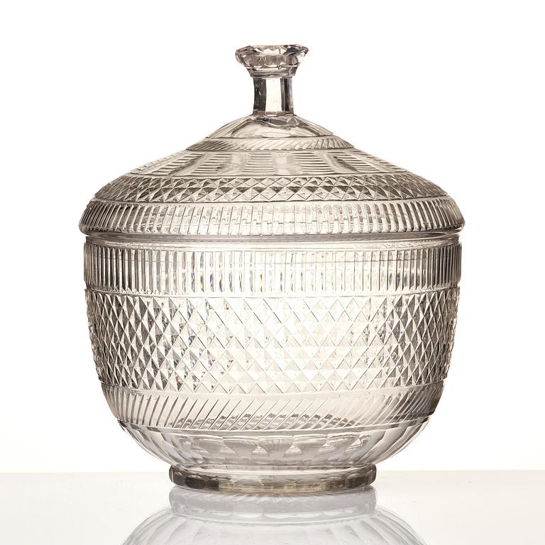 A cut glass punch bowl with cover, stand and ladle, Empire, first part of the 19th century.