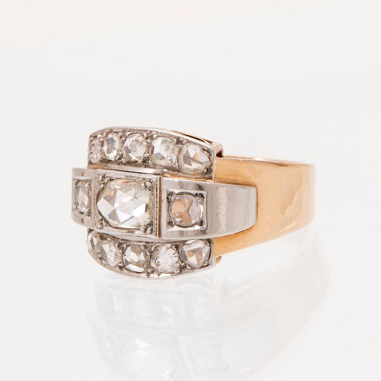 An 18K white and red gold ring set with rose cut diamonds.