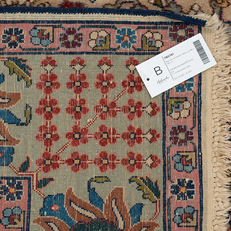 A RUG, a semi-antique Tabriz, ca 198 x 142 cm.