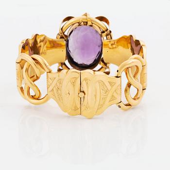 An 18K gold bracelet set with a faceted amethyst, by G Möllenborg.