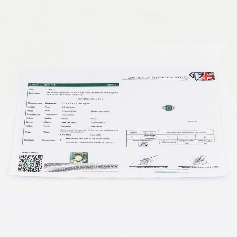 A Bulgari "Trombino" ring in platinum set with a step-cut emerald and round brilliant- and baguette-cut diamonds.