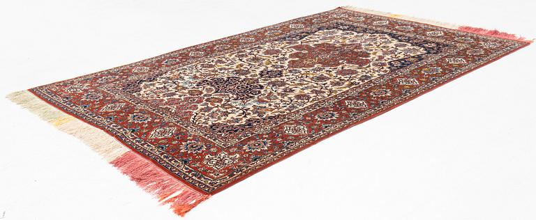 A part silk semi-antique Esfahan carpet, ca 226 x 144 cm.