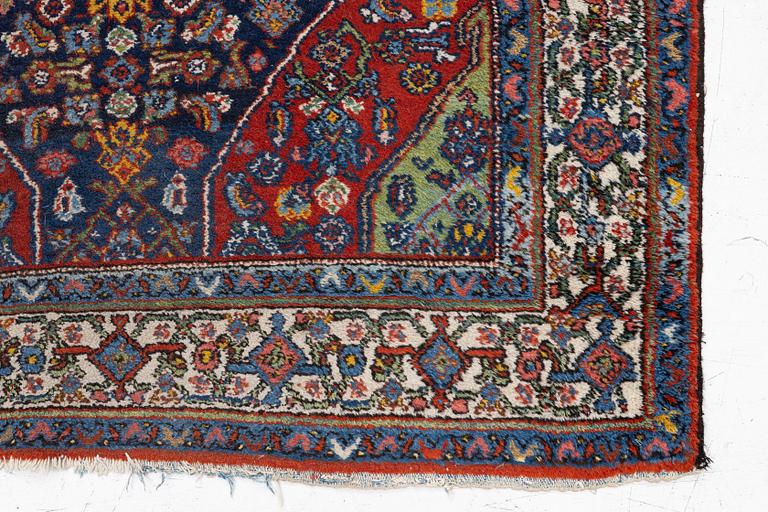 An oriental, semi-antique rug, c. 195 x 130 cm.