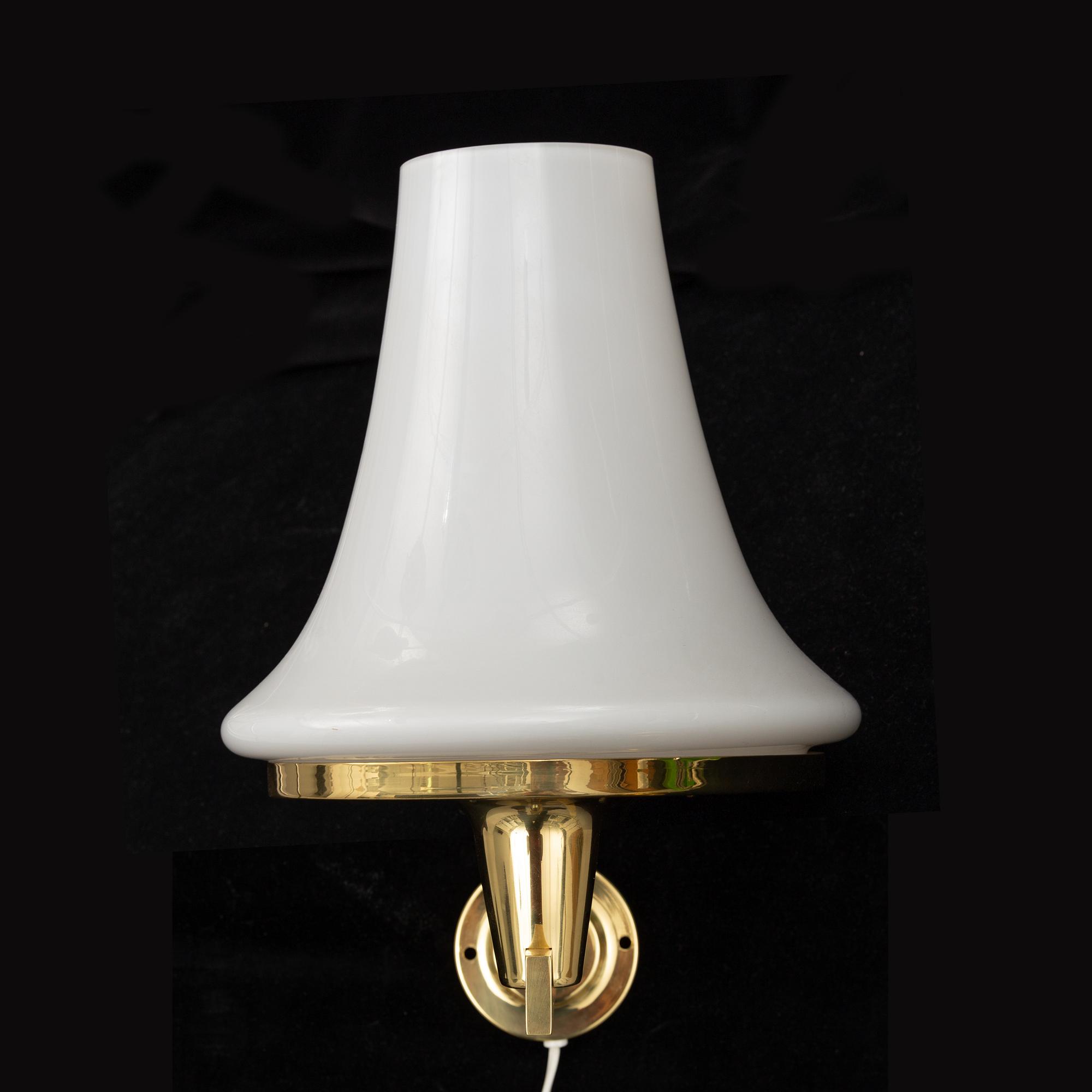 HANS-AGNE JAKOBSSON, a brass ceiling light and wall light from Markaryd, 1960's.