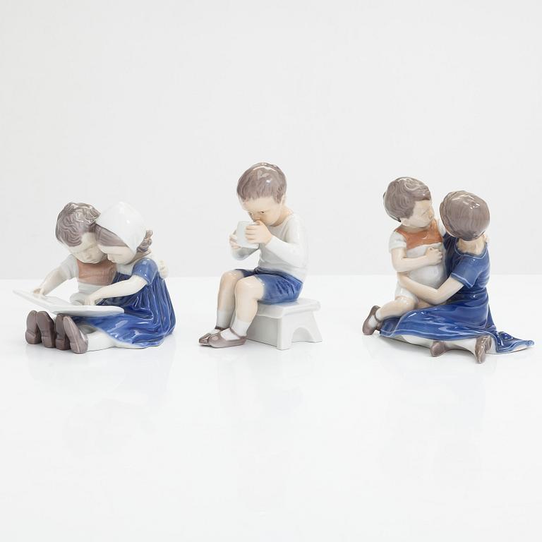 Four Bing & Grondahl figurines and a Royal Copenhagen vase, mid 20th century.