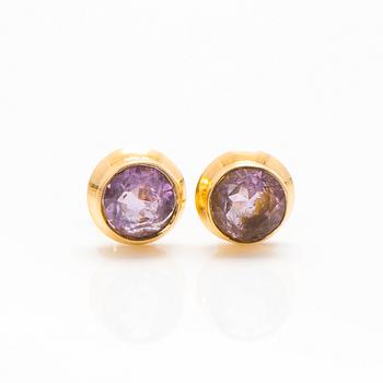 A set of 14K gold earrings and a ring with amethysts.
