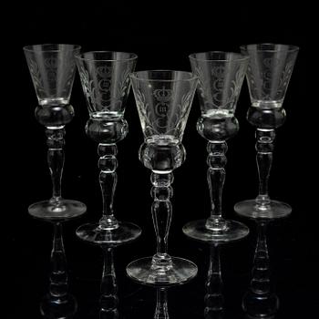 A set of five snapps glasses and a snapps bottle, with Gustav III crowned monogram. 20th century, Baroque-style.