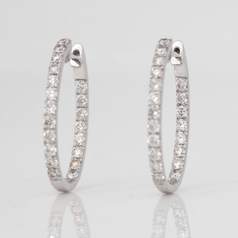 A pair of ovale diamond, 1.38 cts according to engraving, loop earrings.