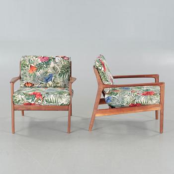 a pair of "USA 75" longe chairs, designed in 1963.