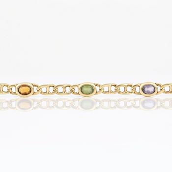 ARMBAND, 14K guld med olikfärgade stenar, sannolikt ametister, citriner och peridoter, Italien. Vikt 12,89 gram.
