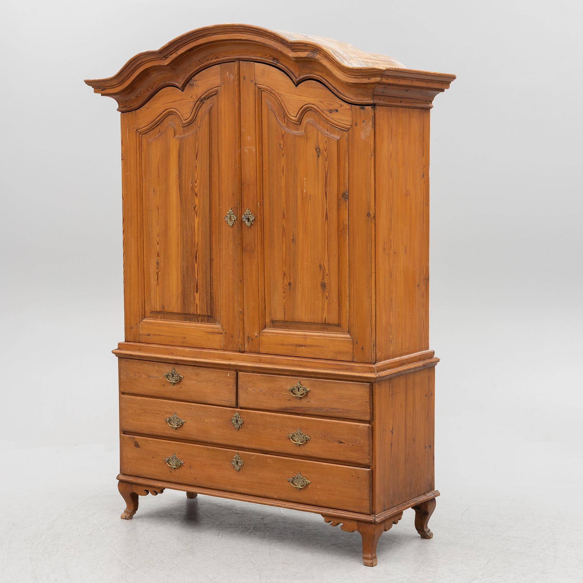 An 18th two-part pine century cabinet.