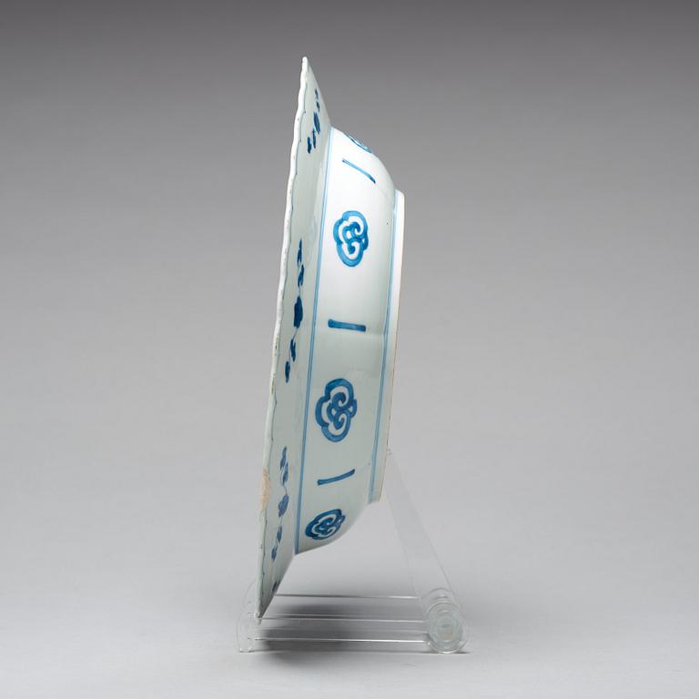 A large blue and white deep dish, Qing dynasty, with Kangxi six character mark and period (1662-1722).