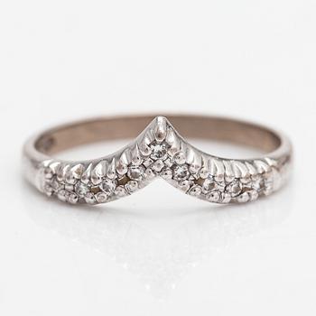 An 18K whitegold ring with diamonds approx 0.045 ct in total.